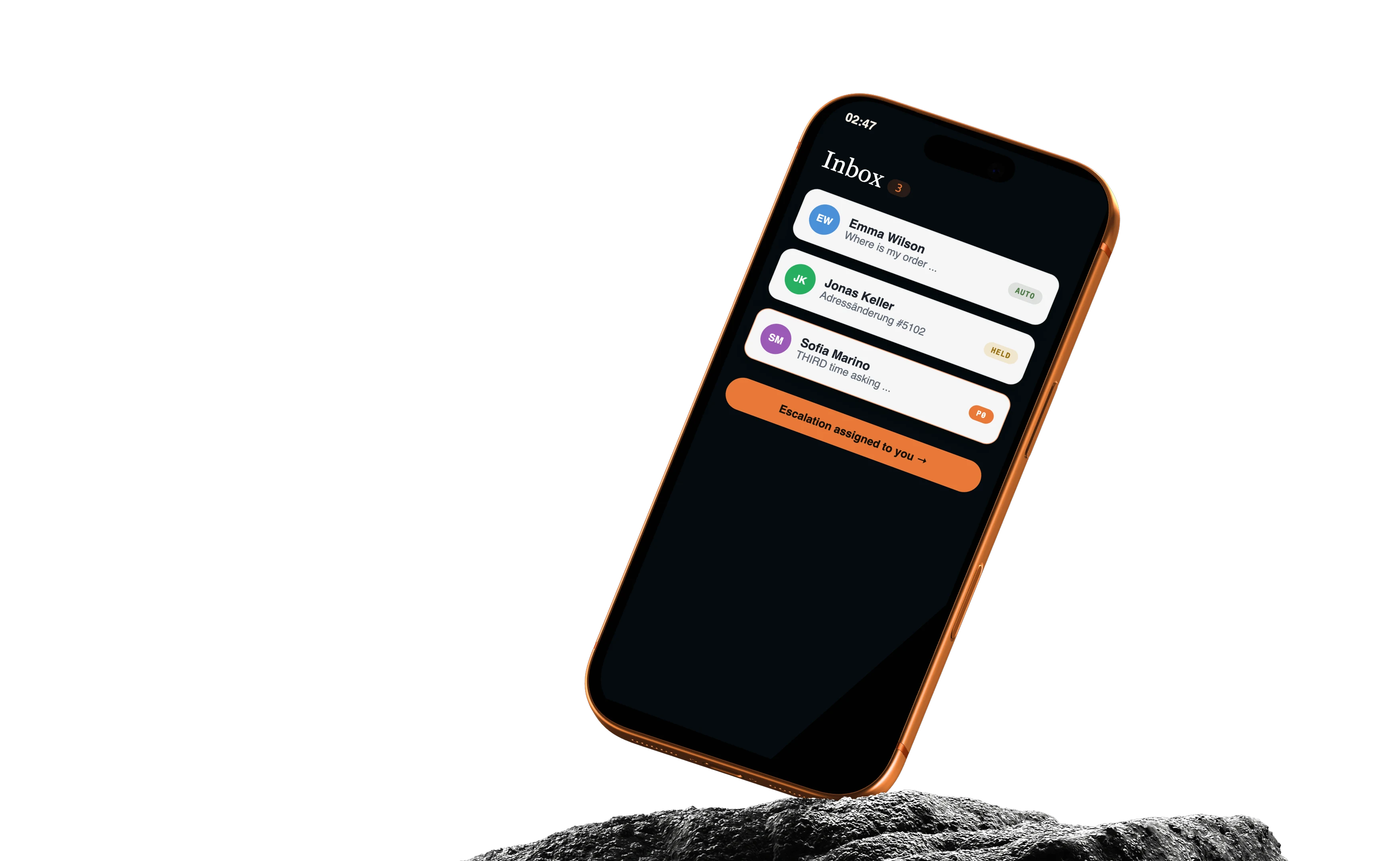 The ReplyBay mobile inbox on a phone standing on a rock in the sea